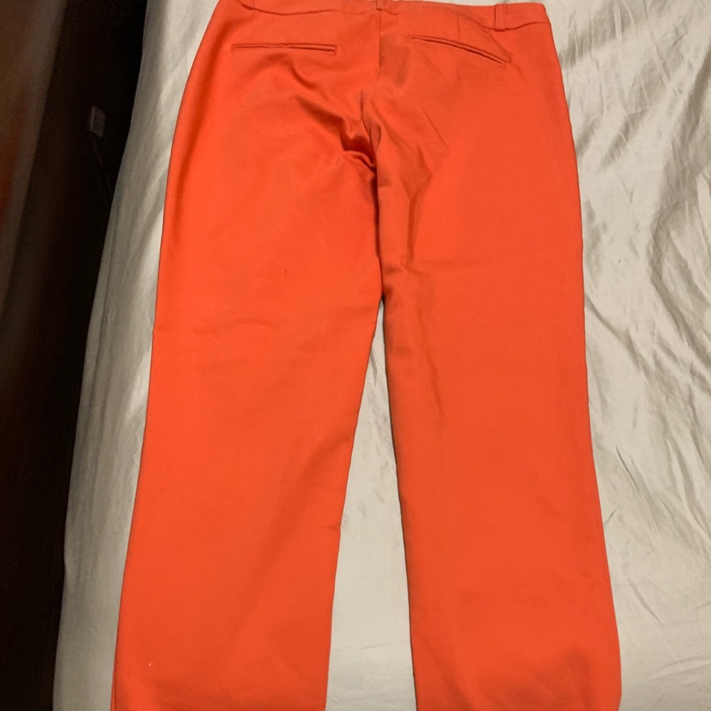 Cute orange pants .